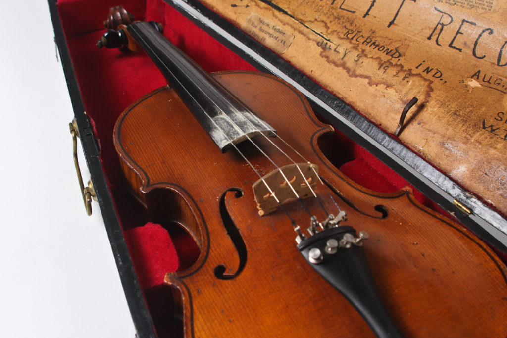 Close up of fiddle in its case.