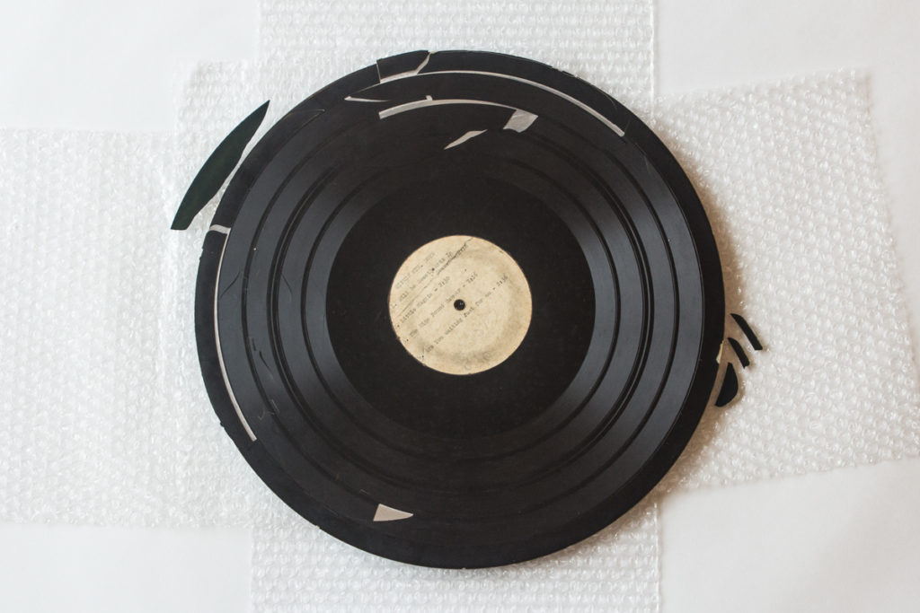 Photograph of the full transcription disc from WCYB's Farm and Fun Time radio show featuring the Stanley Brothers and the Clinch Mountain Boys