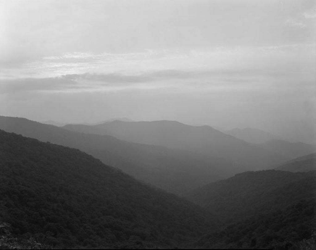Layers of mountains and mist creating an atmospheric and spooky image.