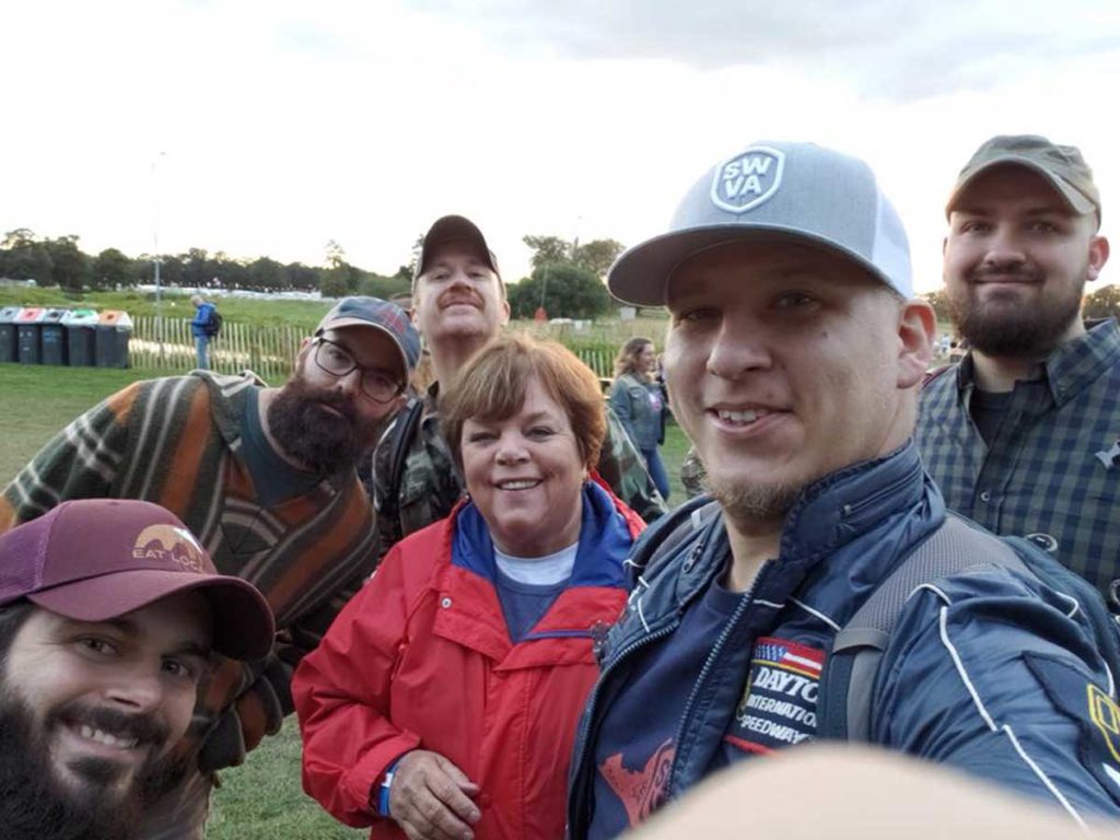 Leah poses with the band Folk Soul Revival at The Long Road Festival in the U.K.
