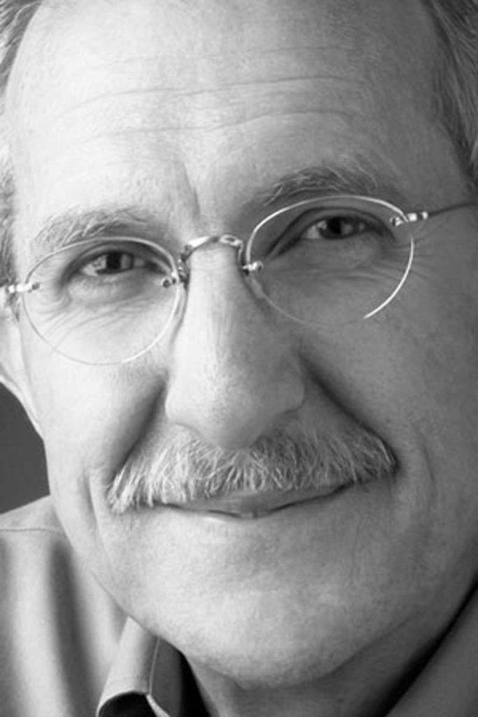 Black-and-white photograph of the author, close-up on his face.