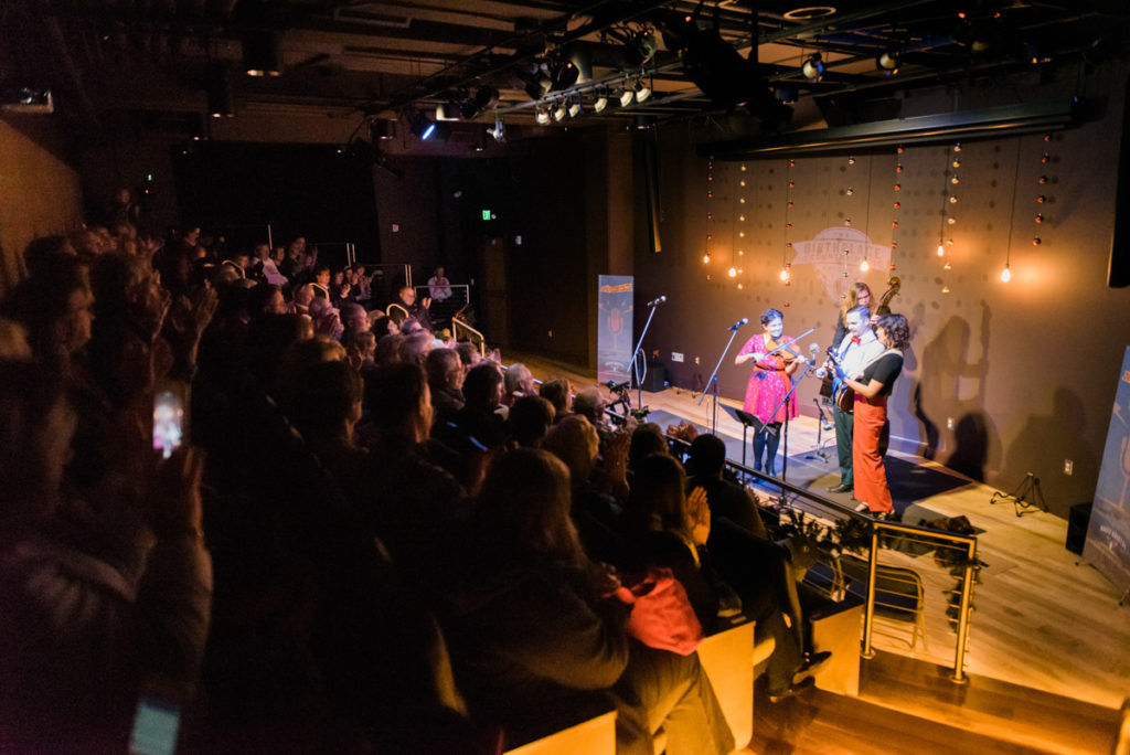 Bill and the Belles on stage with full audience