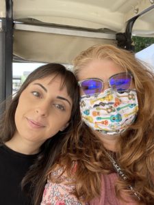 Photo of Danielle Dror and Charlene Baker riding in a golf cart at Bristol Rhythm & Roots Reunion.