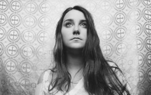 A photo of Katie looking up at the sky.