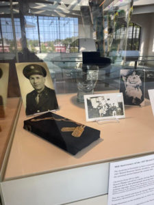 The case on display at the museum has several 1927 Bristol Sessions artists' items, including Ernest Phipp's metal dog tags lying on a small black pedastel in front of a photograph of him in military uniform.