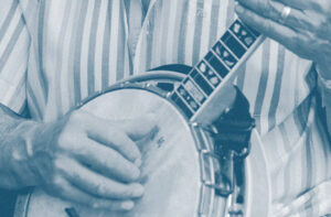 Photo of a man playing banjo.