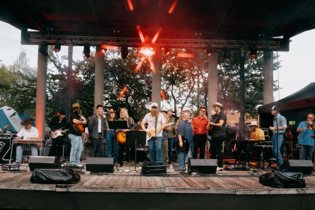 Photo of musicians performing with 49 Winchester during their Super Set finale at Bristol Rhythm & Roots Reunion 2023 on the Cumberland Square Park Stage.
