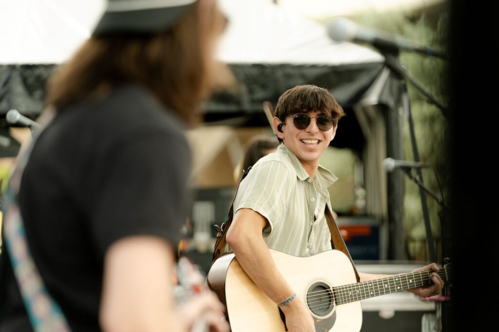 Singer-songwriter Wyatt Flores playing guitar.