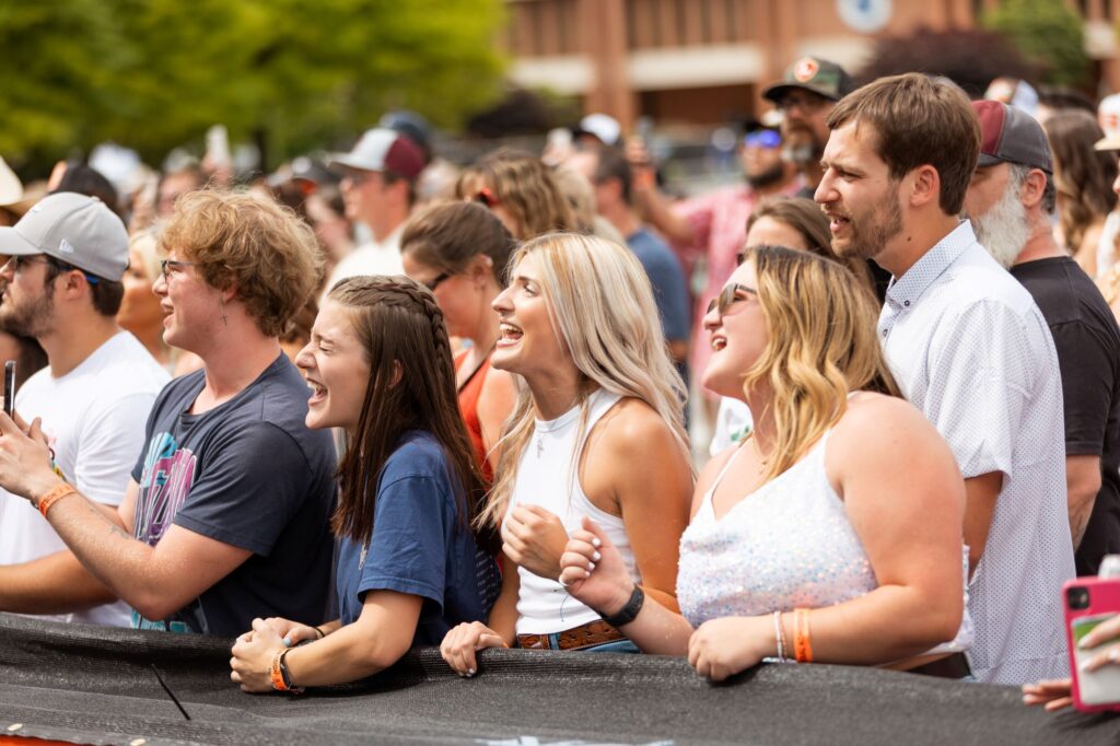 Young fans singing along to Wyatt Flores' songs as he performs.