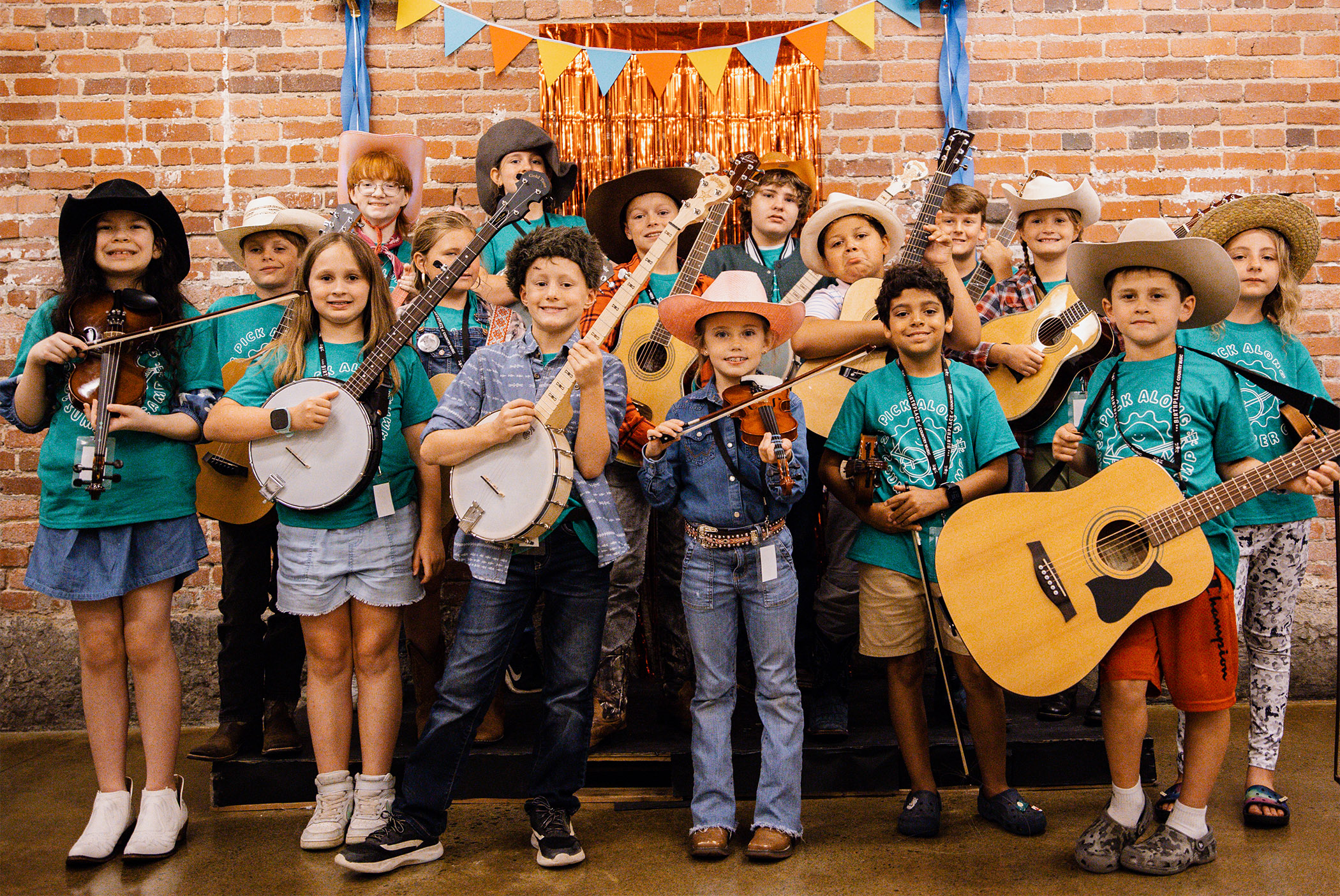 A photo of children holding instruments at Pick Along Summer Camp