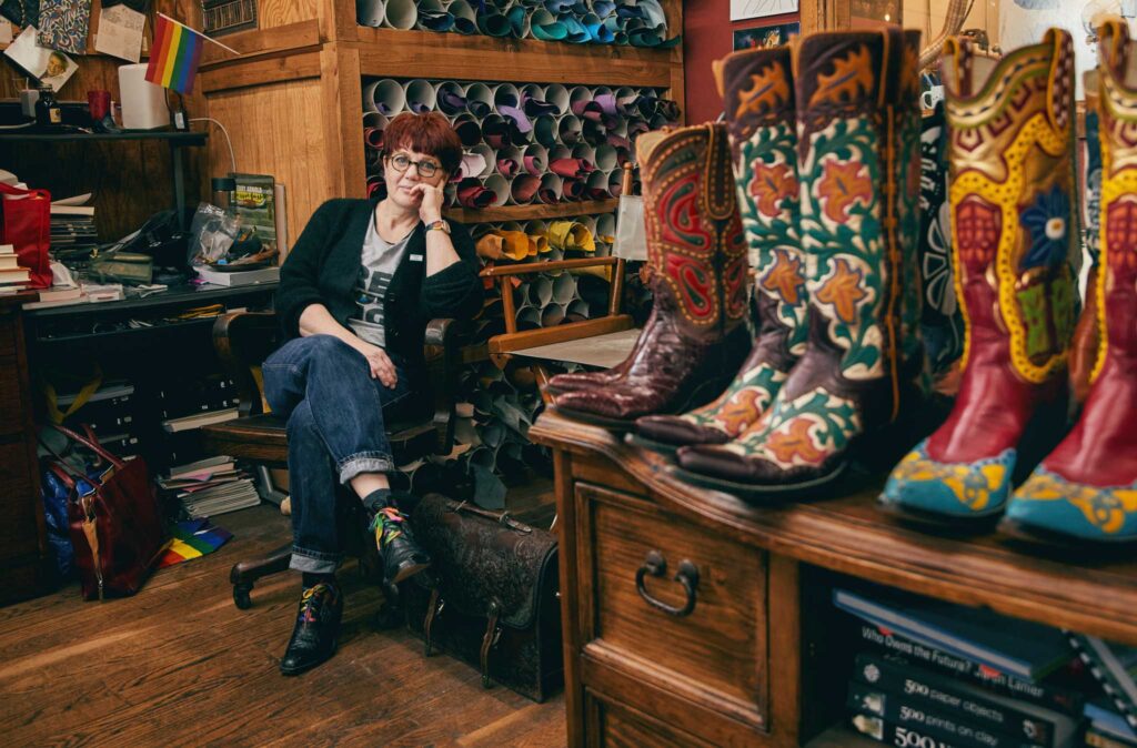 Boot maker Lisa Sorrell in her workshop among many of her cowboy boots.